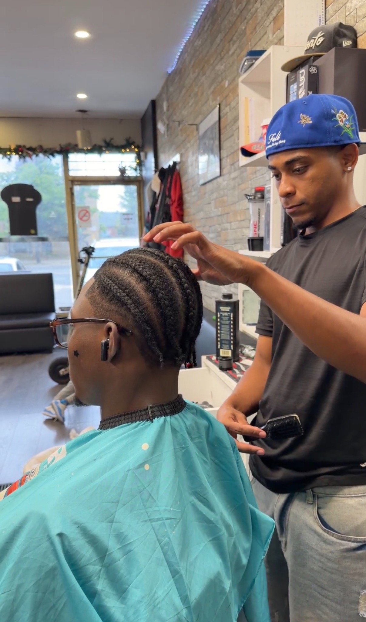 Braiding service at Looney Tunes Barbershop