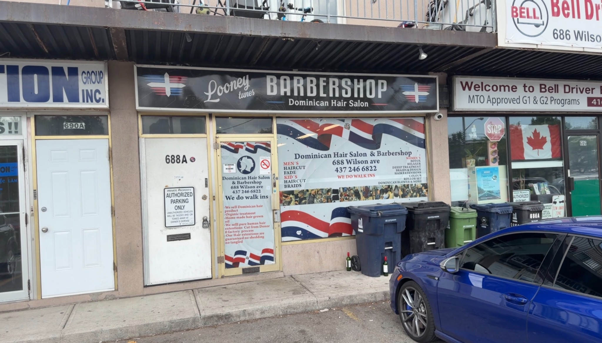 Exterior storefront of Looney Tunes Barbershop